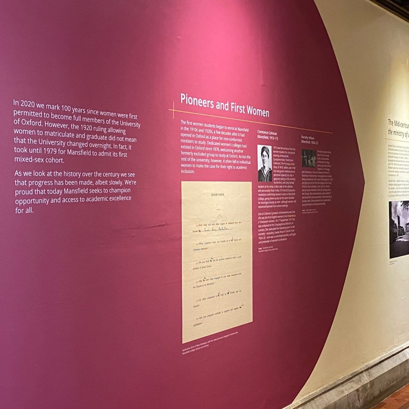 A photo of the Pioneers and First Women display on the walls of the Main Building.