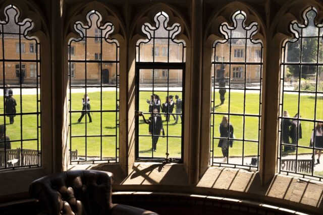 A photo of students on the quad during matriculation from the window grads of the Old Hall.