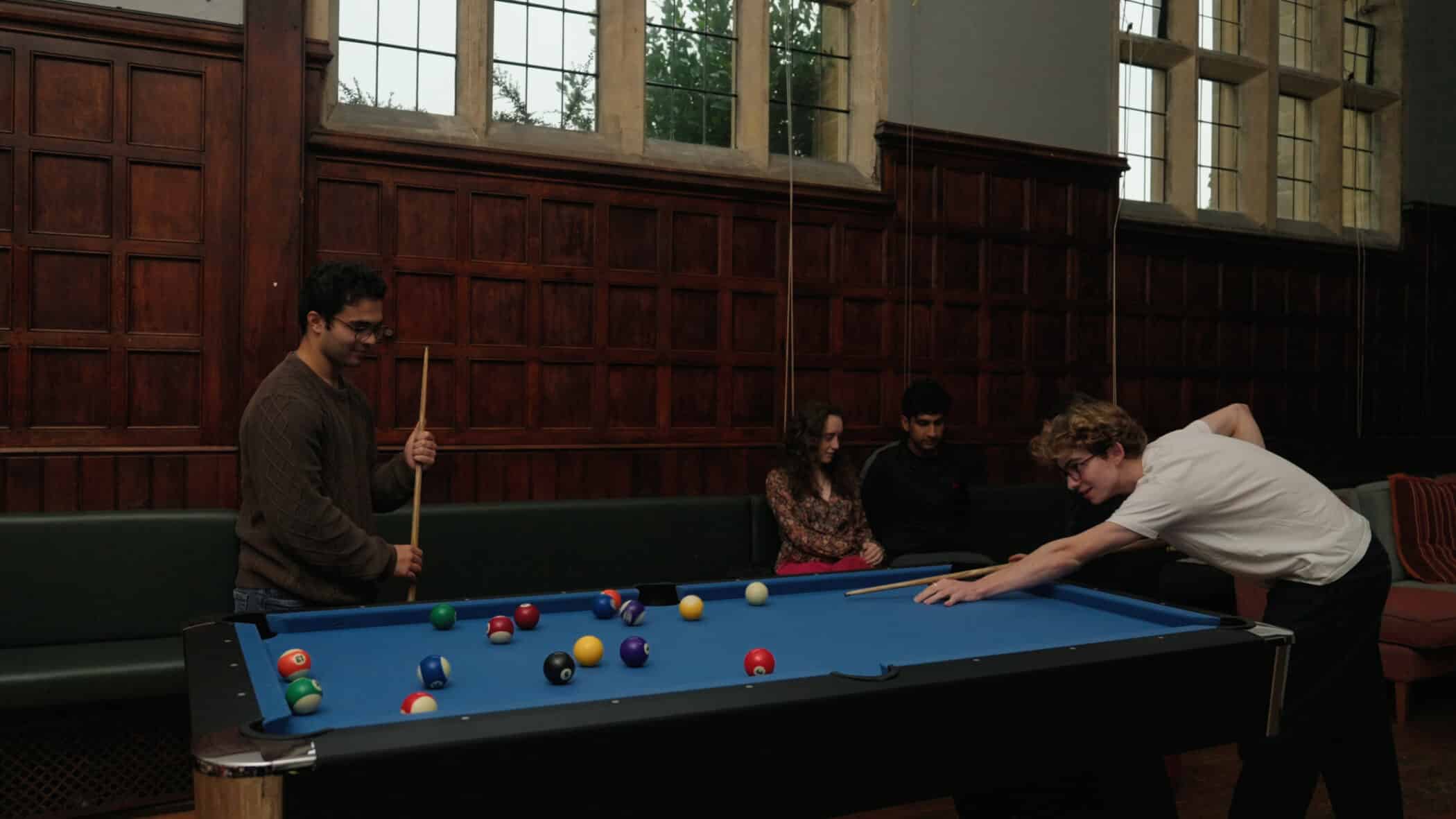 Students playing pool in the JCR.