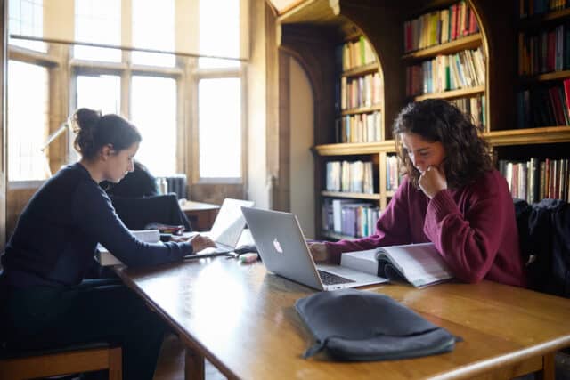 Students studying in the Main College Library.