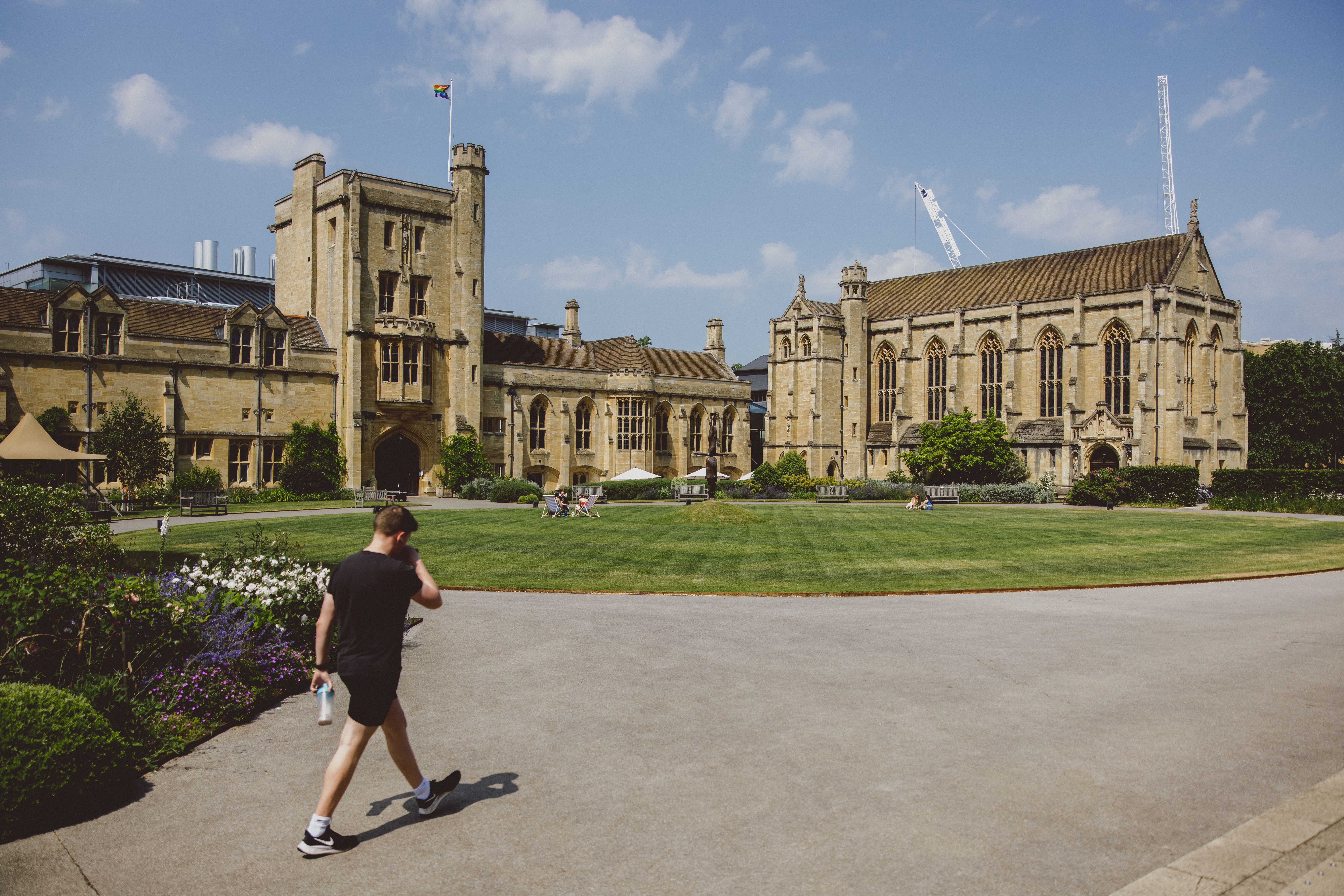 The Main Building with students on the quad in the background.