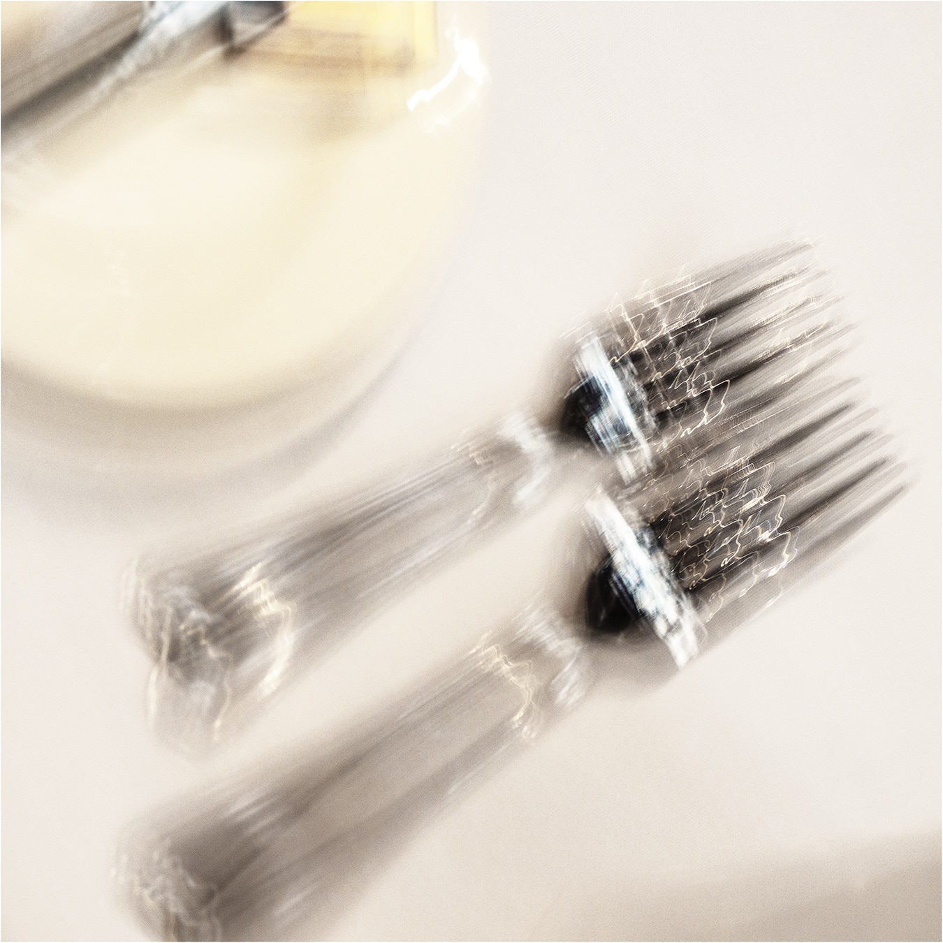 Two forks, tableware.