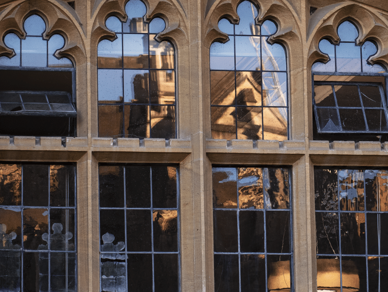 Photo of the Old Hall window grads from the outside.