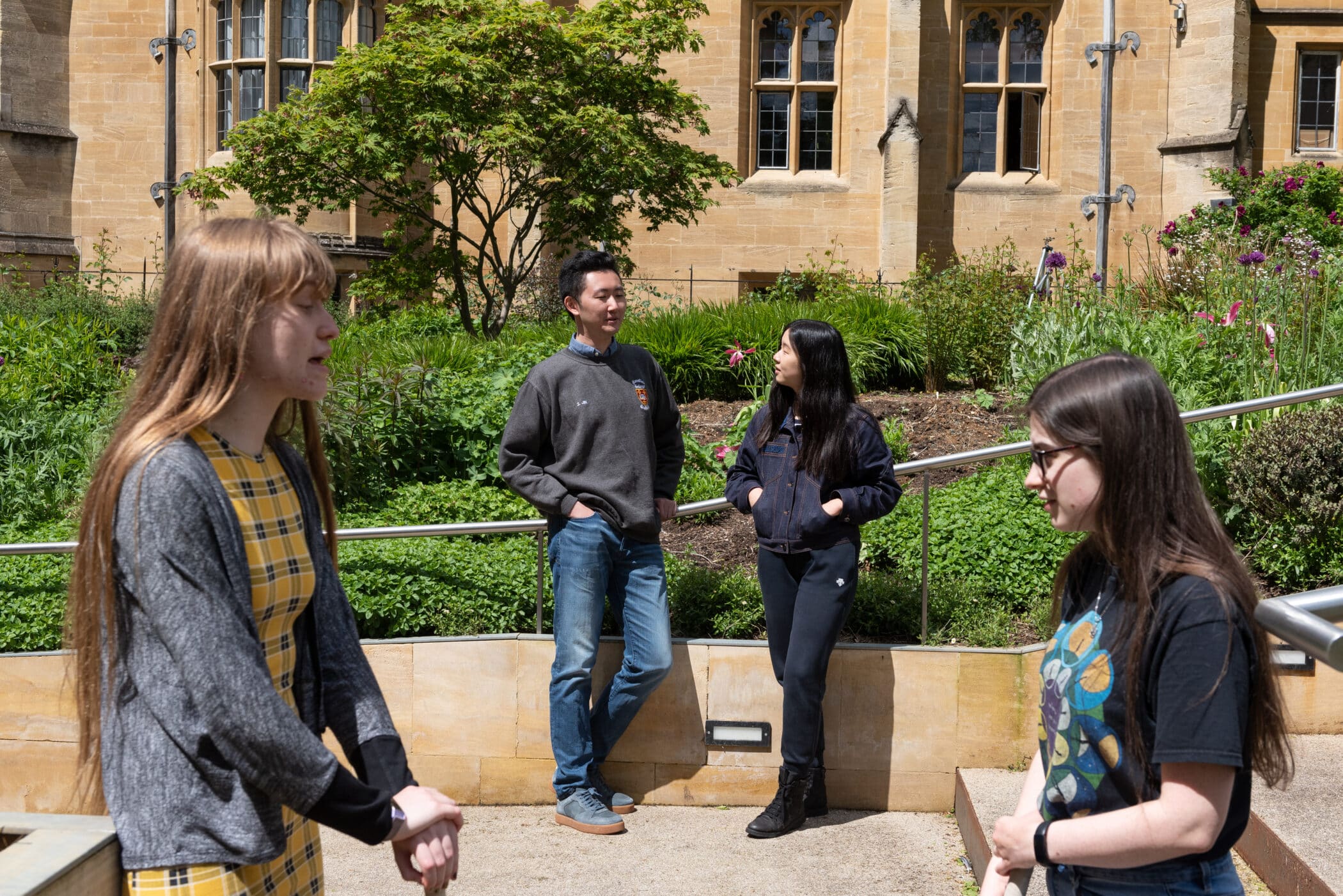 Students talking by the steps of the BIHR.