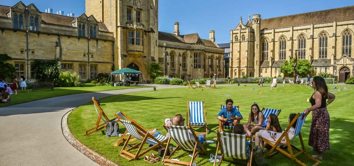Students in deck chairs on the quad.