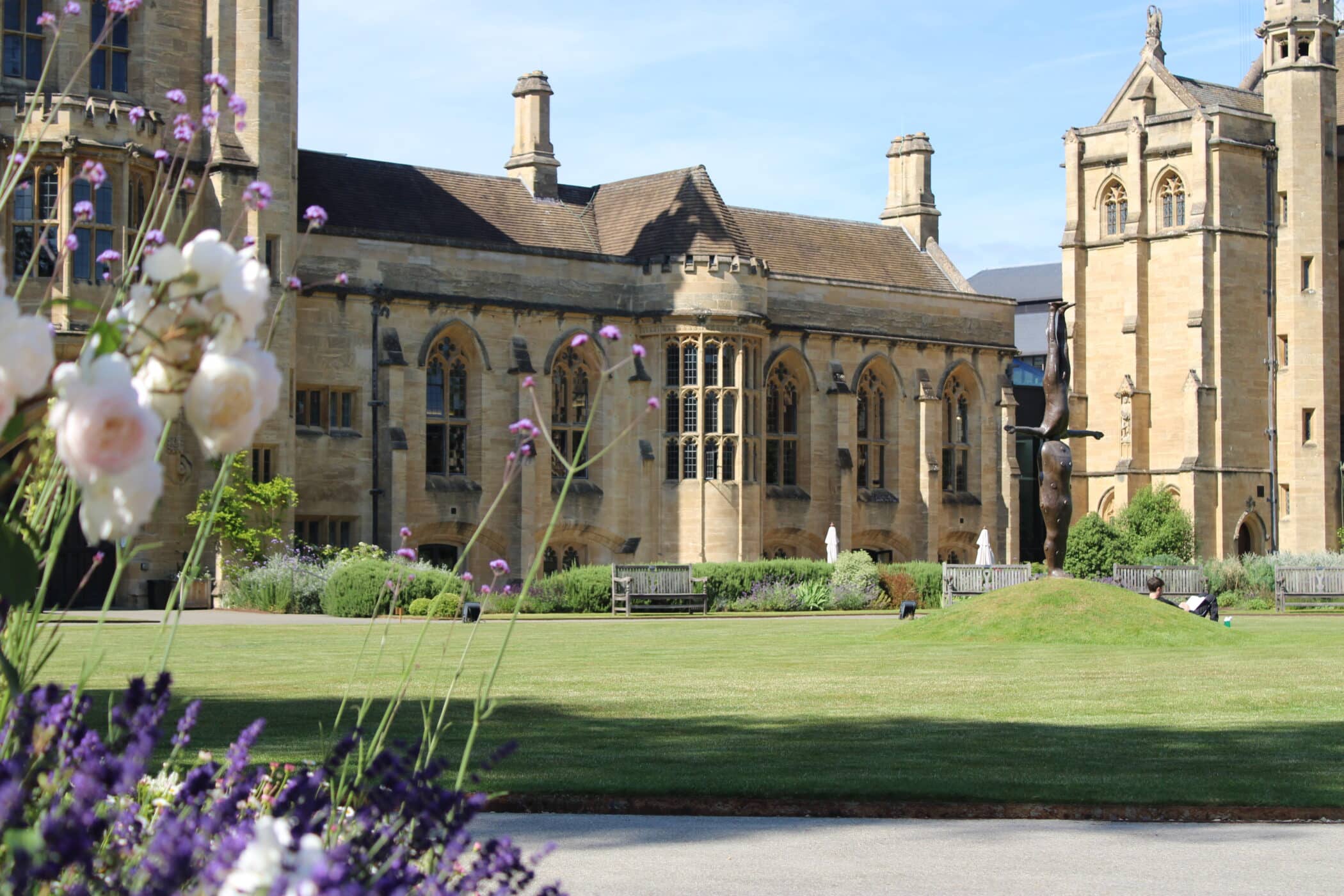 Main Building photo with the Gormley statue in the background.