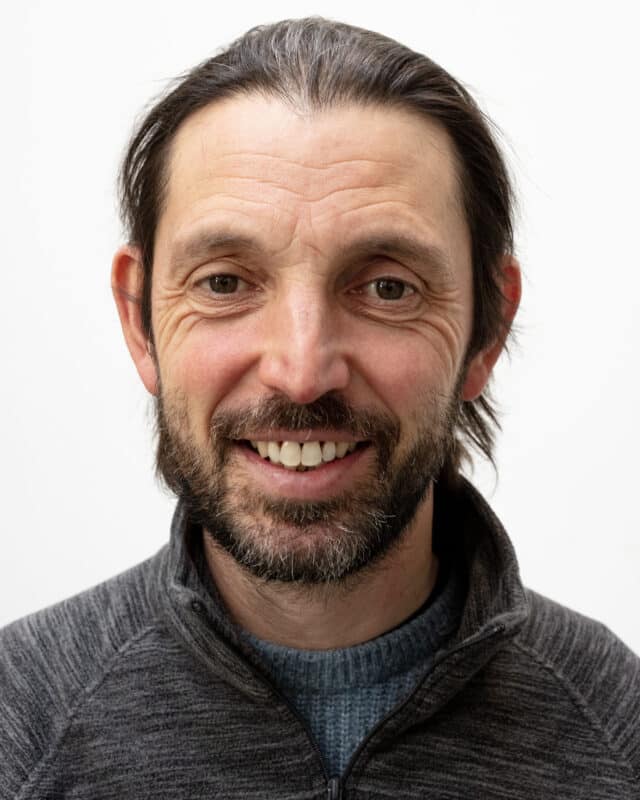 headshot of Andrew Higgins