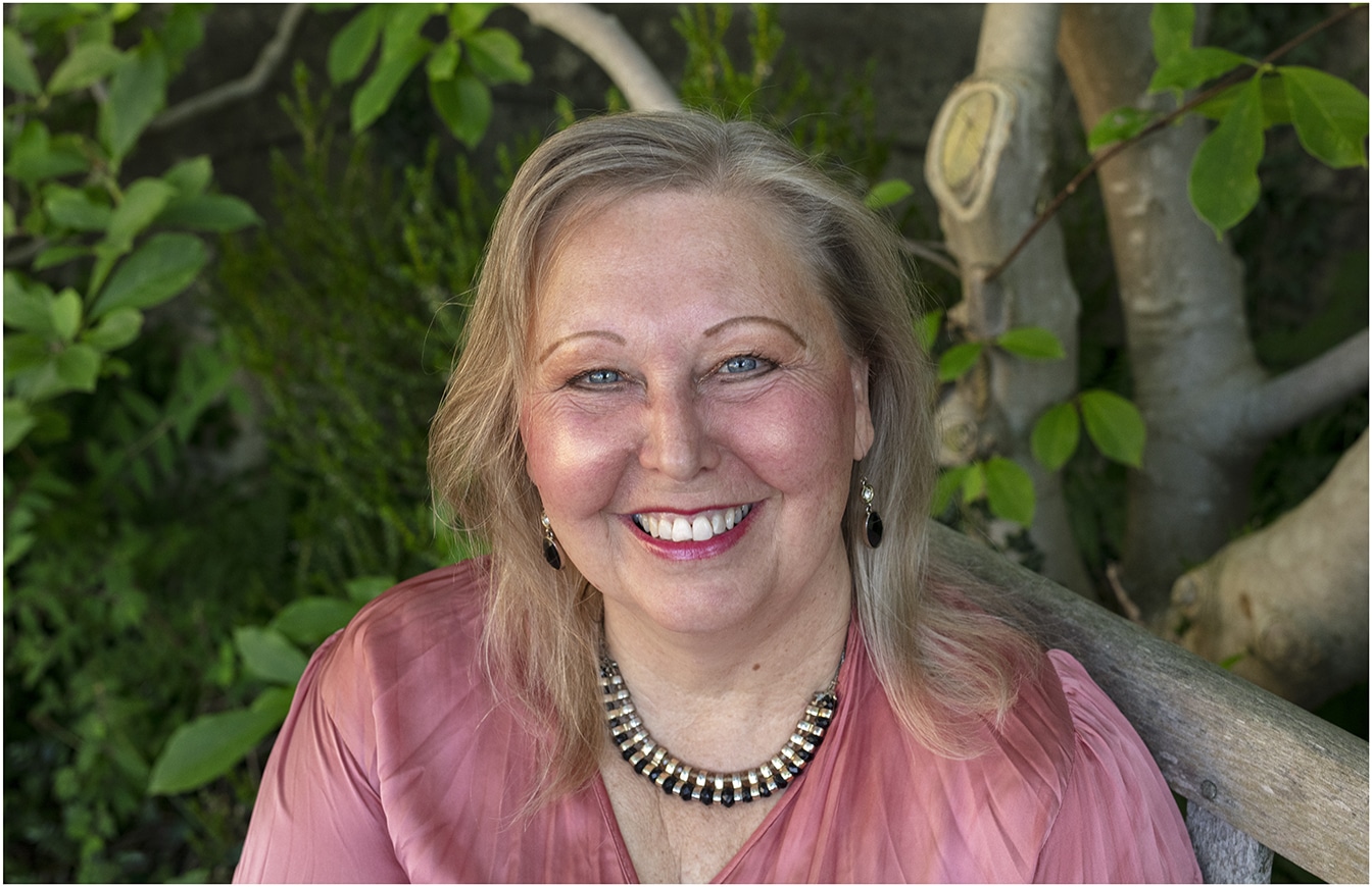 Photo of Lynne by a tree branch