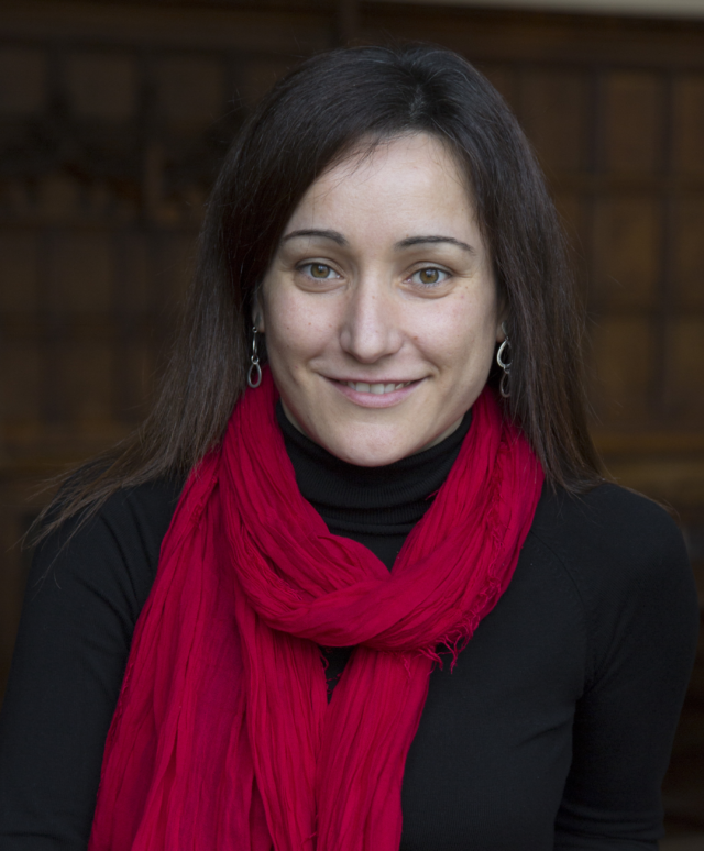 headshot of Vanessa with red scarf around her neck