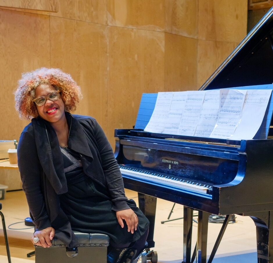 Errollyn sat by a piano