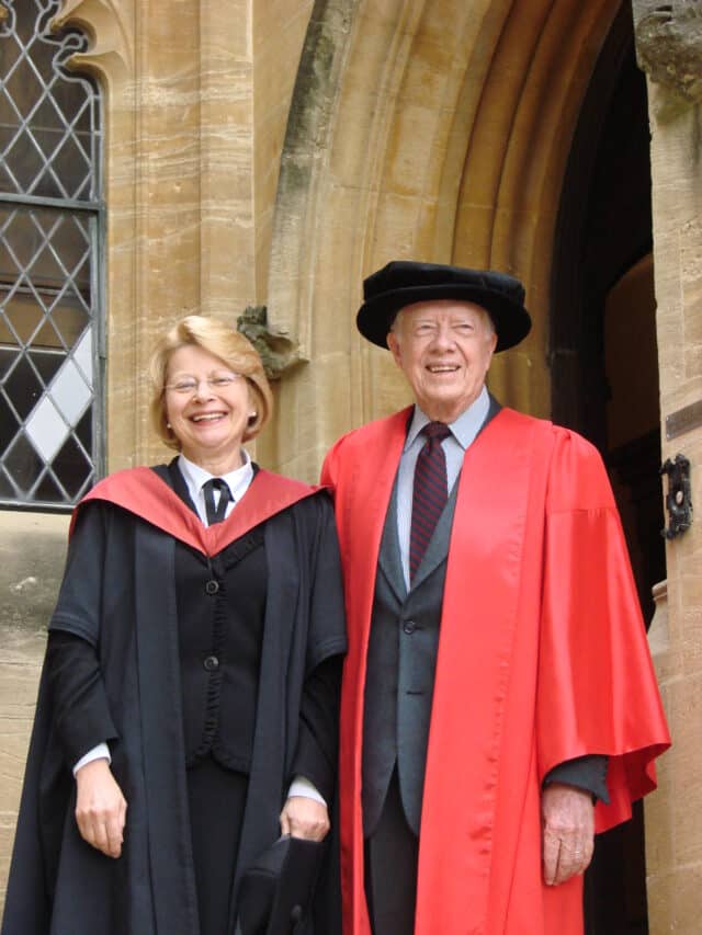 Diana Walford (left) and Jimmy Carter (right) both in academic attire photographed outside the Principal's Lodgings in June 2007